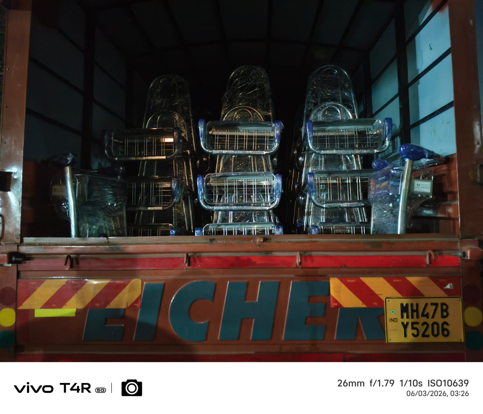Airport luggage trolleys loaded on Eicher truck ready for night dispatch